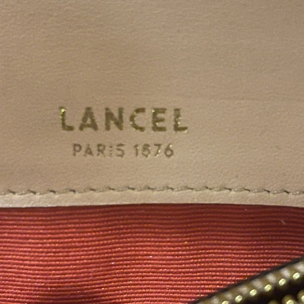 Authentic LANCEL  Italian wallet leather in peach color in good conditions